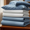 Stack of folded blue and white bedding sheets Royalty Free Stock Photo
