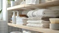 A stack of folded cloth towels and cloth wipes on a shelf in the bathroom replacing disposable paper products Royalty Free Stock Photo