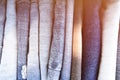 Stack of folded clothes, blue jeans pants, dark blue denim trousers on white background Royalty Free Stock Photo