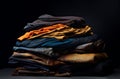A stack of folded clothes on a dark background Royalty Free Stock Photo