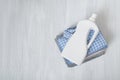Stack of folded clothes and detergent bottle. Top view Royalty Free Stock Photo