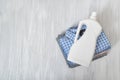 Stack of folded clothes and detergent bottle. Top view Royalty Free Stock Photo