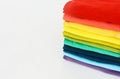 Stack of folded colorful t-shirt on white background Royalty Free Stock Photo