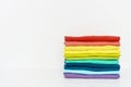 Stack of folded colorful t-shirt on white background Royalty Free Stock Photo