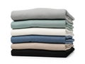 Stack of folded fabrics isolated on white background Royalty Free Stock Photo