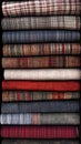 Stack of Folded Fabrics Shows Variety of Textures and Autumnal Colors, Highlighting Textile Design Royalty Free Stock Photo