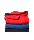 Stack of folded hooded sweat shirts isolated on white background Royalty Free Stock Photo