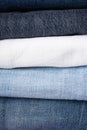 Stack of folded jeans, denim background, close-up Royalty Free Stock Photo