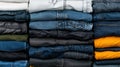 A stack of folded jeans in various colors and styles. Royalty Free Stock Photo