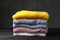 Stack of folded knitted sweaters