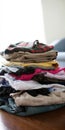 Stack of folded laundry items on wooden floor Royalty Free Stock Photo