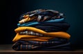A stack of folded plaid and solid colored shirts on a wooden table Royalty Free Stock Photo