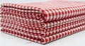 Stack of folded red and white gingham fabric isolated on white background Royalty Free Stock Photo