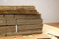 Stack of folded sheets of corrugated cardboard. Recycled materials, sustainable packaging. No waste