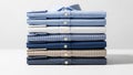 Stack of folded shirts in various blue patterns isolated on white background Royalty Free Stock Photo