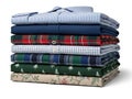 Stack of folded shirts in various patterns Royalty Free Stock Photo