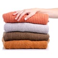 Stack folded sweater clothing hand holding