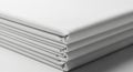 Stack of folded white paper sheets with a clean, minimalistic appearance. The papers are precisely Royalty Free Stock Photo