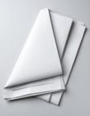 Stack of Folded White Paper Sheets on a Soft White Seamless Background in Studio Royalty Free Stock Photo