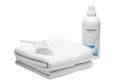 Stack of folded white towels with a bottle of freshstart fabric refresher spray placed beside them Royalty Free Stock Photo
