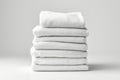 A stack of folded white towels on a table. Royalty Free Stock Photo