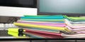 Stack of folders containing work documents in different colors Royalty Free Stock Photo