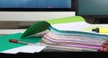 Stack of folders containing work documents in different colors Royalty Free Stock Photo