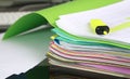 Stack of folders containing work documents in different colors Royalty Free Stock Photo