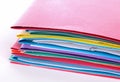 Stack of folders containing work documents in different colors Royalty Free Stock Photo