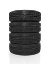 Stack of four black tires