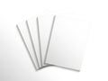 A stack of four blank white papers on a clean white background isolated on white background Royalty Free Stock Photo