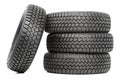 Stack of four car wheel winter tires isolated Royalty Free Stock Photo