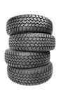 Stack of four car wheel winter tires isolated Royalty Free Stock Photo