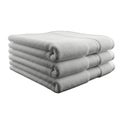Stack of neatly folded white towels on plain white background for hospitality home decor and cleaning products advertising Royalty Free Stock Photo