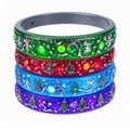 Stack of Four Colorful Christmas Themed Bangle Bracelets on White Royalty Free Stock Photo