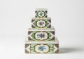 Stack of four decorative floral patterned storage boxes Royalty Free Stock Photo
