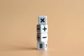 The stack of four dice with arithmetic operation symbols on soft orange background. Royalty Free Stock Photo