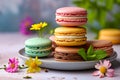 Stack of four different colored macarons on plate with flower and some leaves nearby. Generative AI Royalty Free Stock Photo