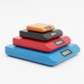 Stack of Four Digital Kitchen Scales in Different Colors and Sizes digital scale weighing scale Royalty Free Stock Photo