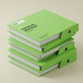 A stack of four green ring binders, each labeled \