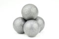 Stack of four lead musket balls on white Royalty Free Stock Photo