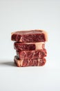 Stack of Four Premium Raw Beef Steaks on White Background Royalty Free Stock Photo