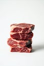 Stack of Four Premium Raw Beef Steaks on White Background Royalty Free Stock Photo