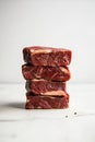 Stack of Four Raw Premium Steaks on Bright White Background Royalty Free Stock Photo