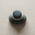 A stack of four smooth, flat pebbles arranged in descending order of size on a Royalty Free Stock Photo