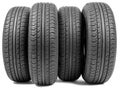 Stack of four wheel new black tyres Royalty Free Stock Photo