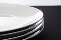 Stack of Four White Shiny Plates Royalty Free Stock Photo