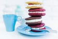 Stack of four whoopie pies or moon pies with cup and spoon. Royalty Free Stock Photo