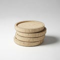 A stack of four wooden discs is arranged neatly on a gray surface Royalty Free Stock Photo
