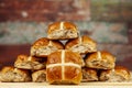 Stack of fresh golden hot cross buns Royalty Free Stock Photo